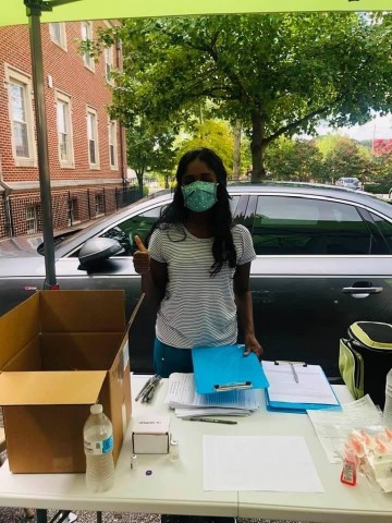 Ritika Chanda volunteering with Intown Collaborative Ministries during a vaccination clinic. Ritika Chanda volunteering with Intown Collaborative Ministries during a vaccination clinic.